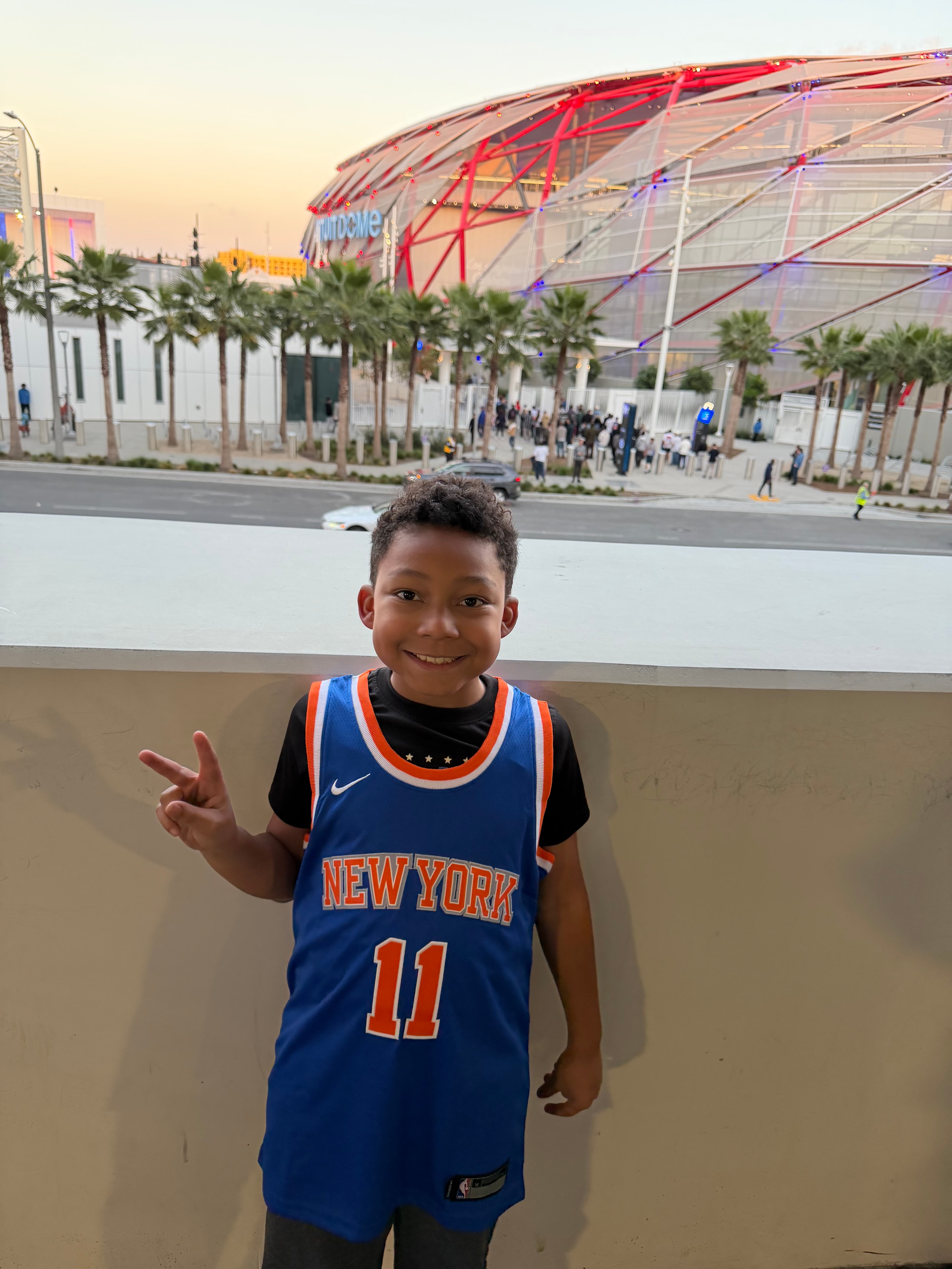 TreDelRey in NY Knicks jersey at an outdoor event